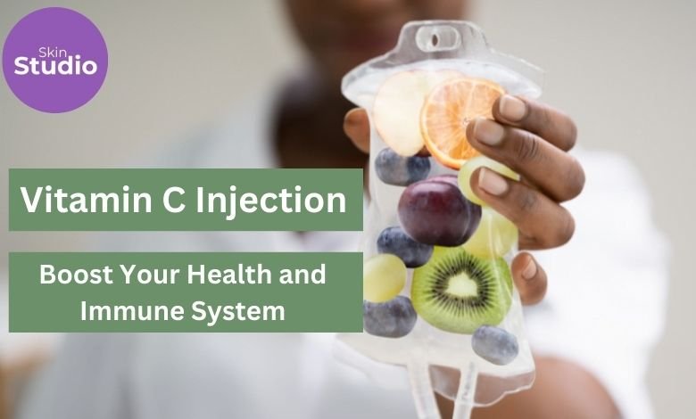 A medical professional holding an IV drip bag filled with fresh fruits like oranges, grapes, and kiwi, symbolizing the benefits of Vitamin C injection for health and immune system support. Skin Studio logo in the top left corner.